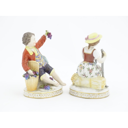 178 - Two Continental Sitzendorf style figures, a boy modelled as a grape picker, and a girl modelled as a... 