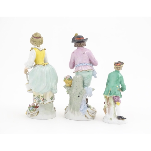 179 - Three porcelain figures to include a Derby style figure modelled as a gardener wearing a black hat, ... 