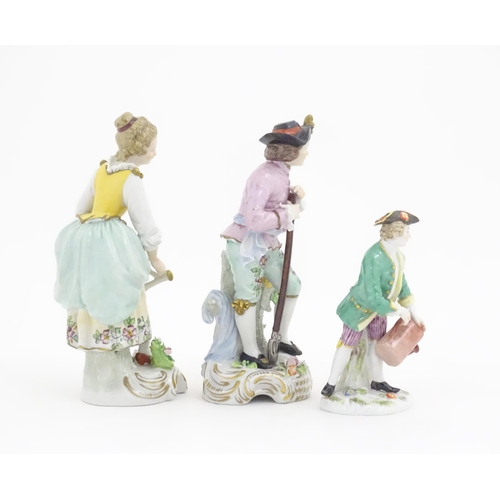 179 - Three porcelain figures to include a Derby style figure modelled as a gardener wearing a black hat, ... 