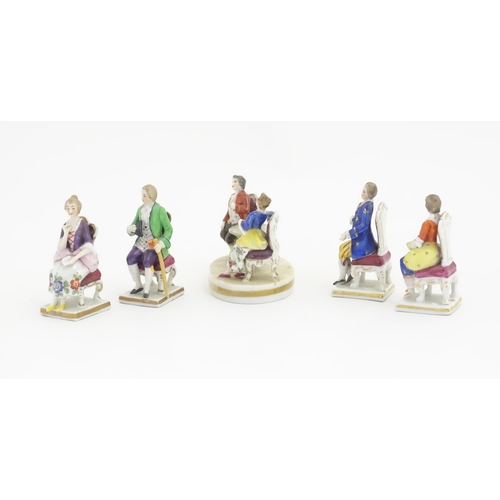 184 - A quantity of assorted Continental porcelain miniatures formed as Regency figures. Some marked under... 