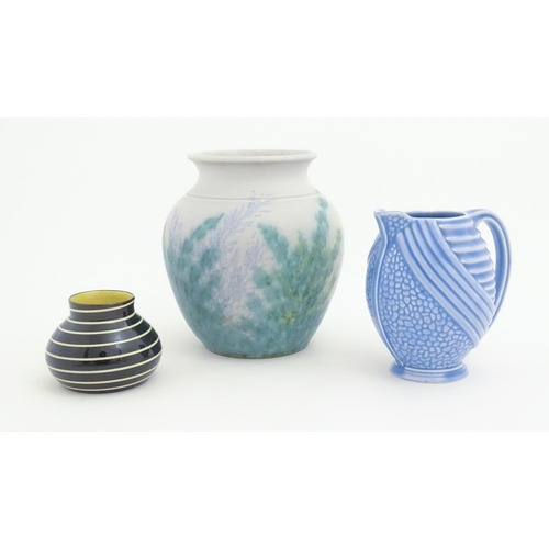 187 - Three assorted ceramic items to include a Wade Art Deco jug, a Bourne Denby vase with stylised folia... 