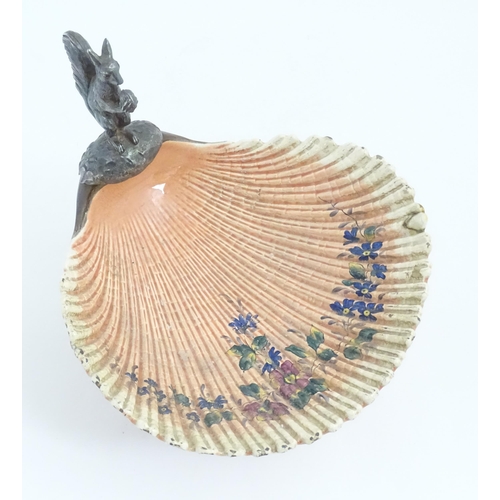 195 - A Sarreguemines tazza / comport of shell form with flower detail, with silver plate foot and a model... 