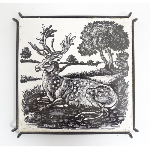 206 - Three assorted tiles to include a monochrome Minton tile decorated with a fallow deer in a landscape... 