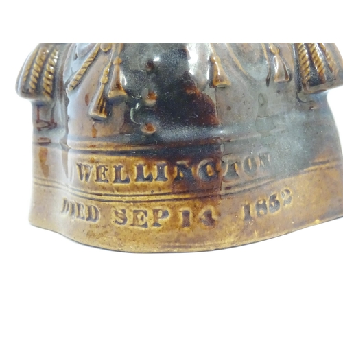 208 - A Victorian treacle glazed character jug modelled as the bust of the Duke of Wellington. Together wi... 