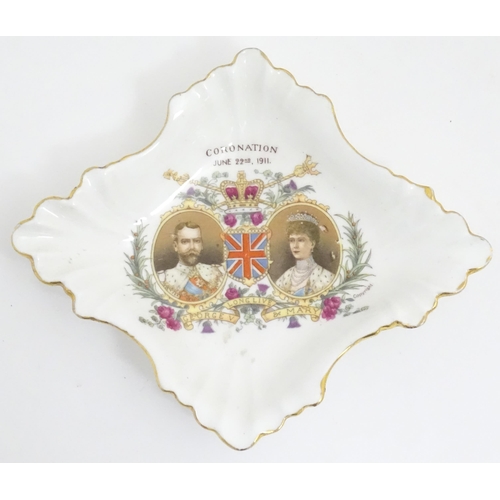 230 - Four commemorative George V Coronation wares to include beaker, tankard, tea cup and pin dish. Maker... 