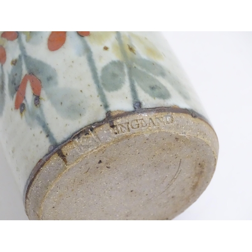 232 - A Colin Kellam studio pottery stoneware brush pot with fuschia flower decoration. Marked to foot. To... 