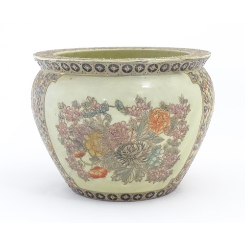 236 - A Chinese jardiniere / planter decorated with flowers and foliage, the interior with fish bowl detai... 