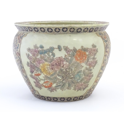 236 - A Chinese jardiniere / planter decorated with flowers and foliage, the interior with fish bowl detai... 