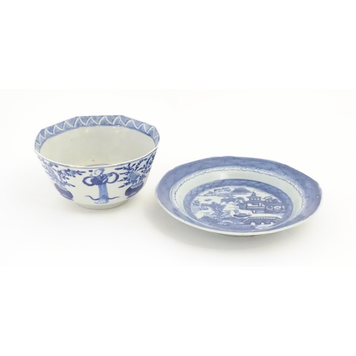 238 - A Chinese blue and white bowl of octagonal form decorated with figures and vases of flowers in bloom... 