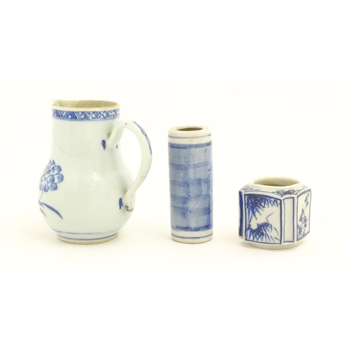 239 - A Chinese blue and white jug decorated with trees, leaves, flowers and foliage. Together with a cyli... 