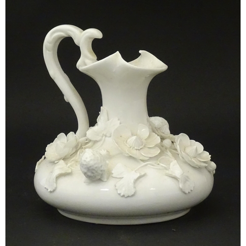 63 - A Derby white glazed jug decorated with encrusted flowers, leaves and strawberries. Marked under. Ap... 