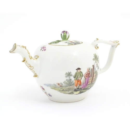 66 - A Meissen teapot decorated with pastoral scenes with figures in a rural landscape. The spout modelle... 