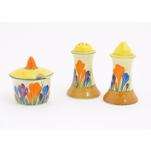 73 - A Clarice Cliff three piece cruet comprising salt, pepper and mustard pot, decorated in the Crocus p... 