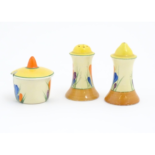 73 - A Clarice Cliff three piece cruet comprising salt, pepper and mustard pot, decorated in the Crocus p... 