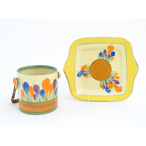 74 - A Clarice Cliff sandwich plate decorated in the Crocus pattern. Together with a Clarice Cliff biscui... 