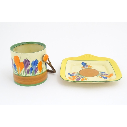 74 - A Clarice Cliff sandwich plate decorated in the Crocus pattern. Together with a Clarice Cliff biscui... 