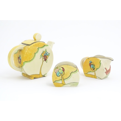 77 - A Clarice Cliff tea set decorated in the Moonlight pattern comprising teapot, sugar bowl and milk ju... 