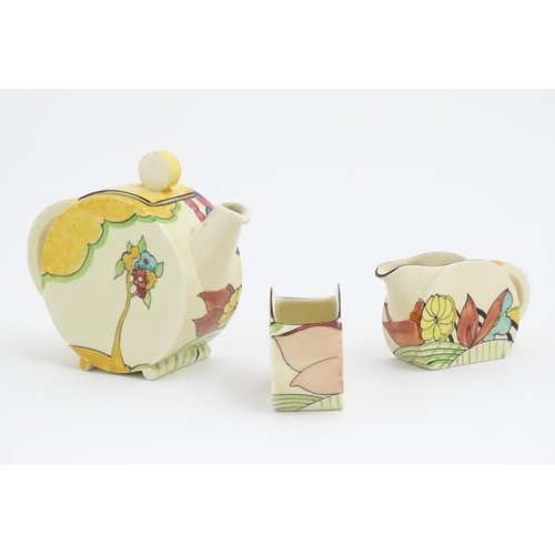 77 - A Clarice Cliff tea set decorated in the Moonlight pattern comprising teapot, sugar bowl and milk ju... 