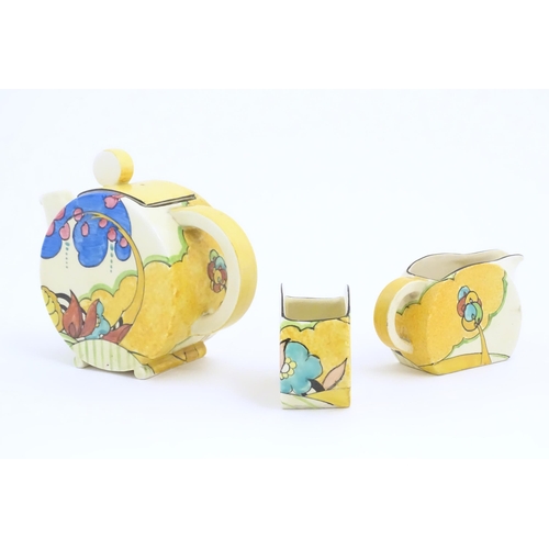 77 - A Clarice Cliff tea set decorated in the Moonlight pattern comprising teapot, sugar bowl and milk ju... 