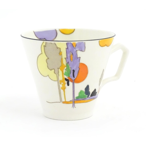 86 - An Art Deco Tams Ware cup and saucer decorated in the Woodland pattern. Together with a limited edit... 