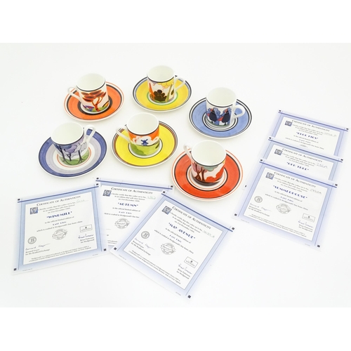 87 - Six Wedgwood Clarice Cliff Centenary coffee cups and saucers in the patterns Windmill, Autumn, May A... 