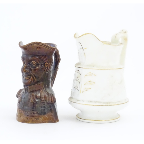 208 - A Victorian treacle glazed character jug modelled as the bust of the Duke of Wellington. Together wi... 