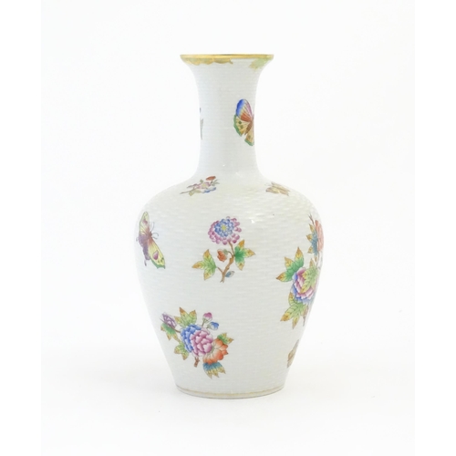 253 - A Herend porcelain vase decorated in the pattern Queen Victoria. Marked under. Approx. 10 1/2