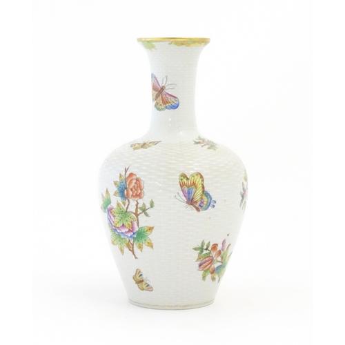 253 - A Herend porcelain vase decorated in the pattern Queen Victoria. Marked under. Approx. 10 1/2