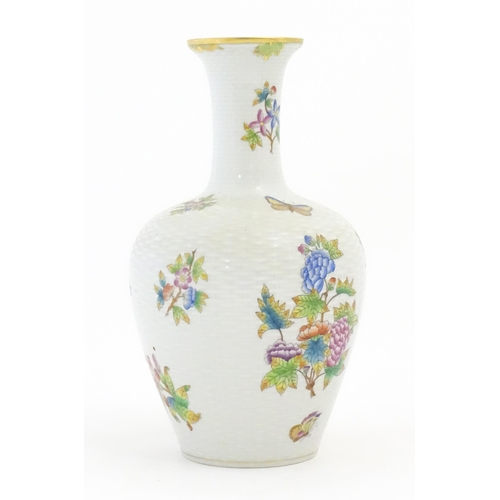 253 - A Herend porcelain vase decorated in the pattern Queen Victoria. Marked under. Approx. 10 1/2