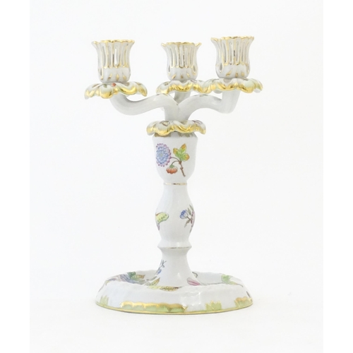 255 - A Herend porcelain two sectional three branch candlestick / candelabrum decorated in the pattern Que... 