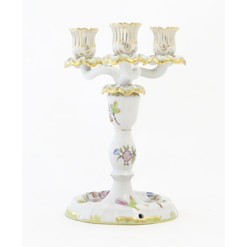 255 - A Herend porcelain two sectional three branch candlestick / candelabrum decorated in the pattern Que... 