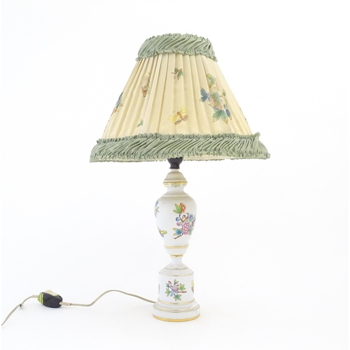 256 - A Herend porcelain table lamp decorated in the Queen Victoria pattern, with original shade. Marked u... 