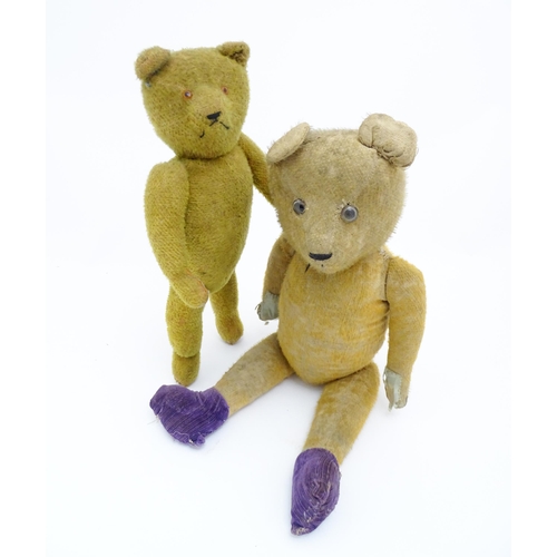 1429 - Toys: An early 20thC straw filled teddy bear with glass eyes, stitched nose and mouth and growler me... 