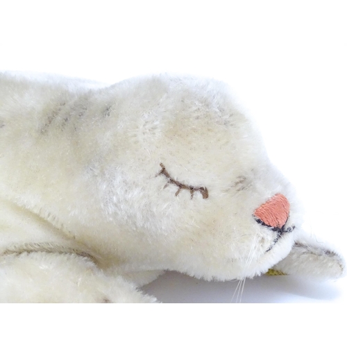 1444 - Toy: A 20thC Steiff mohair soft toy modelled as a sleeping seal - Floppy Robby, with stitched nose, ... 