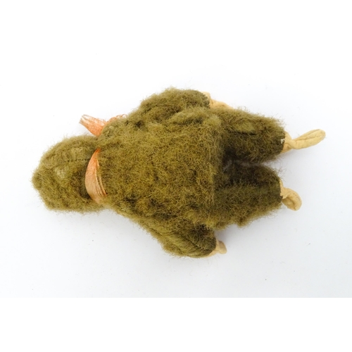 1447 - Toy: A small 20thC straw filled soft toy modelled as a monkey / chimpanzee with felt face, ears and ... 