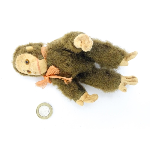 1447 - Toy: A small 20thC straw filled soft toy modelled as a monkey / chimpanzee with felt face, ears and ... 