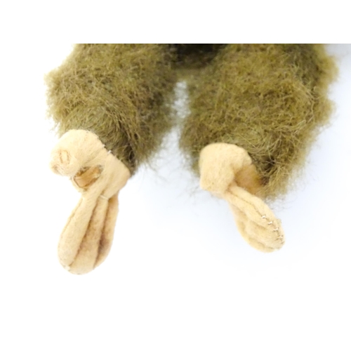 1447 - Toy: A small 20thC straw filled soft toy modelled as a monkey / chimpanzee with felt face, ears and ... 