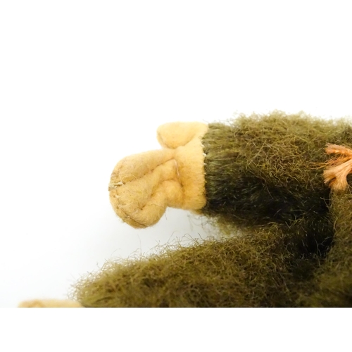 1447 - Toy: A small 20thC straw filled soft toy modelled as a monkey / chimpanzee with felt face, ears and ... 