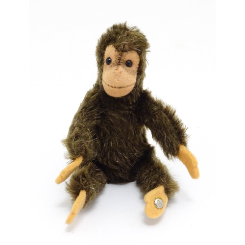 1448 - Toy: A small 20thC Steiff mohair soft toy modelled as a monkey / chimpanzee, with felt face, ears an... 