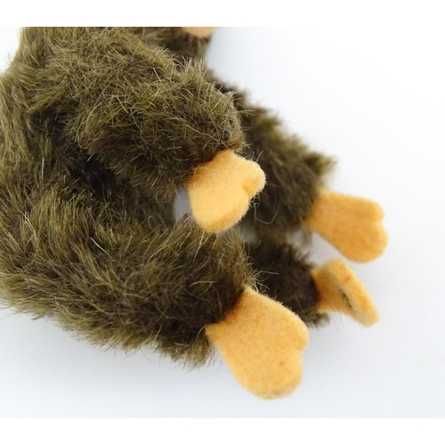 1448 - Toy: A small 20thC Steiff mohair soft toy modelled as a monkey / chimpanzee, with felt face, ears an... 