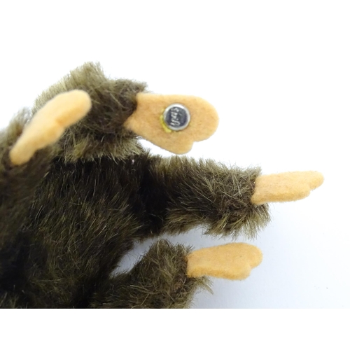 1448 - Toy: A small 20thC Steiff mohair soft toy modelled as a monkey / chimpanzee, with felt face, ears an... 