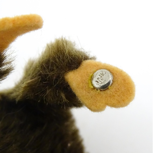 1448 - Toy: A small 20thC Steiff mohair soft toy modelled as a monkey / chimpanzee, with felt face, ears an... 