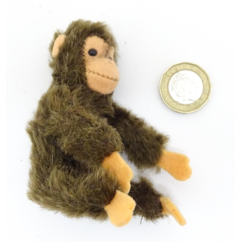 1448 - Toy: A small 20thC Steiff mohair soft toy modelled as a monkey / chimpanzee, with felt face, ears an... 