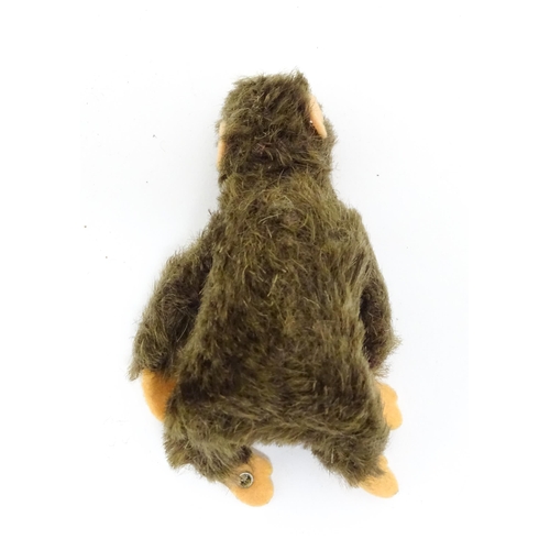 1448 - Toy: A small 20thC Steiff mohair soft toy modelled as a monkey / chimpanzee, with felt face, ears an... 