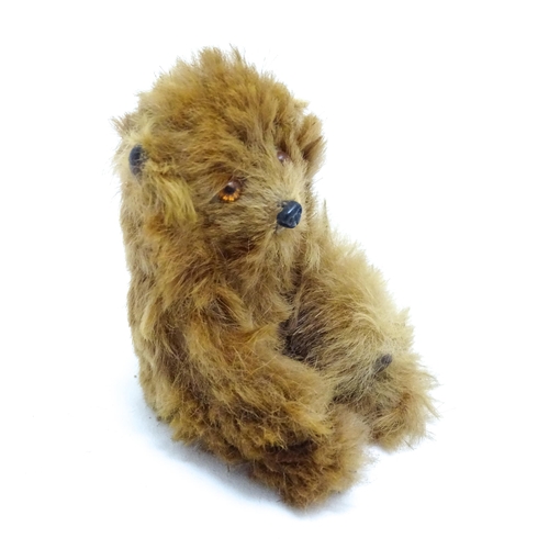 1449 - Toy: A 20thC small plush miniature model of a teddy bear. Approx. 3