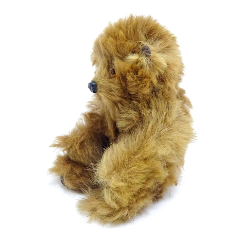 1449 - Toy: A 20thC small plush miniature model of a teddy bear. Approx. 3