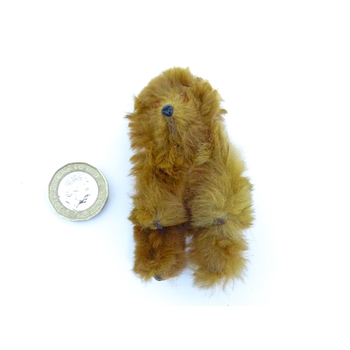 1449 - Toy: A 20thC small plush miniature model of a teddy bear. Approx. 3