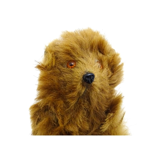 1449 - Toy: A 20thC small plush miniature model of a teddy bear. Approx. 3