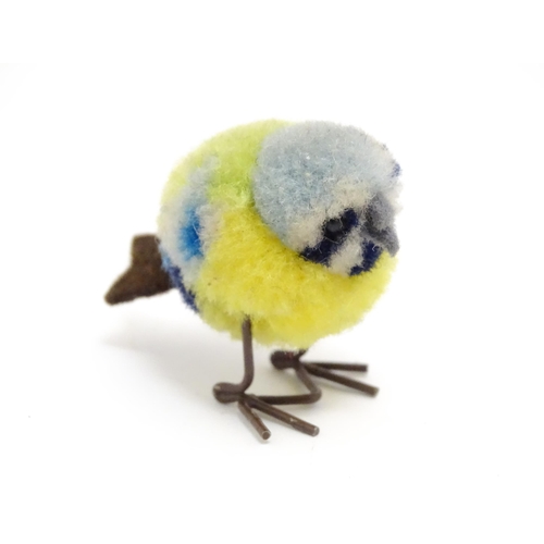 1451 - Toy: An early 20thC Steiff woollen model of a miniature blue tit bird, with felt tail and beak and w... 