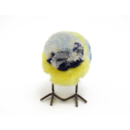 1451 - Toy: An early 20thC Steiff woollen model of a miniature blue tit bird, with felt tail and beak and w... 